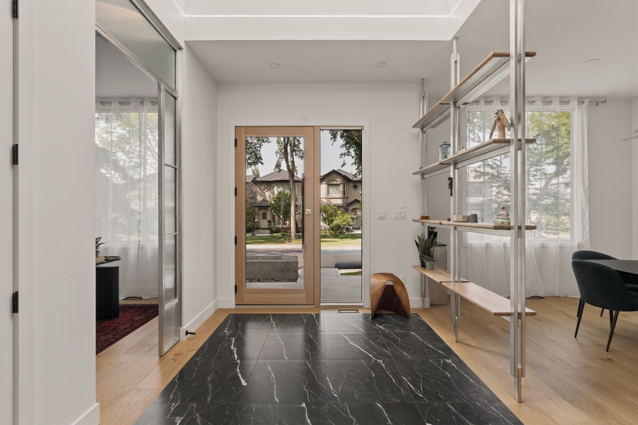 Interior entryway with the front door, entrance hall and built-in shelving