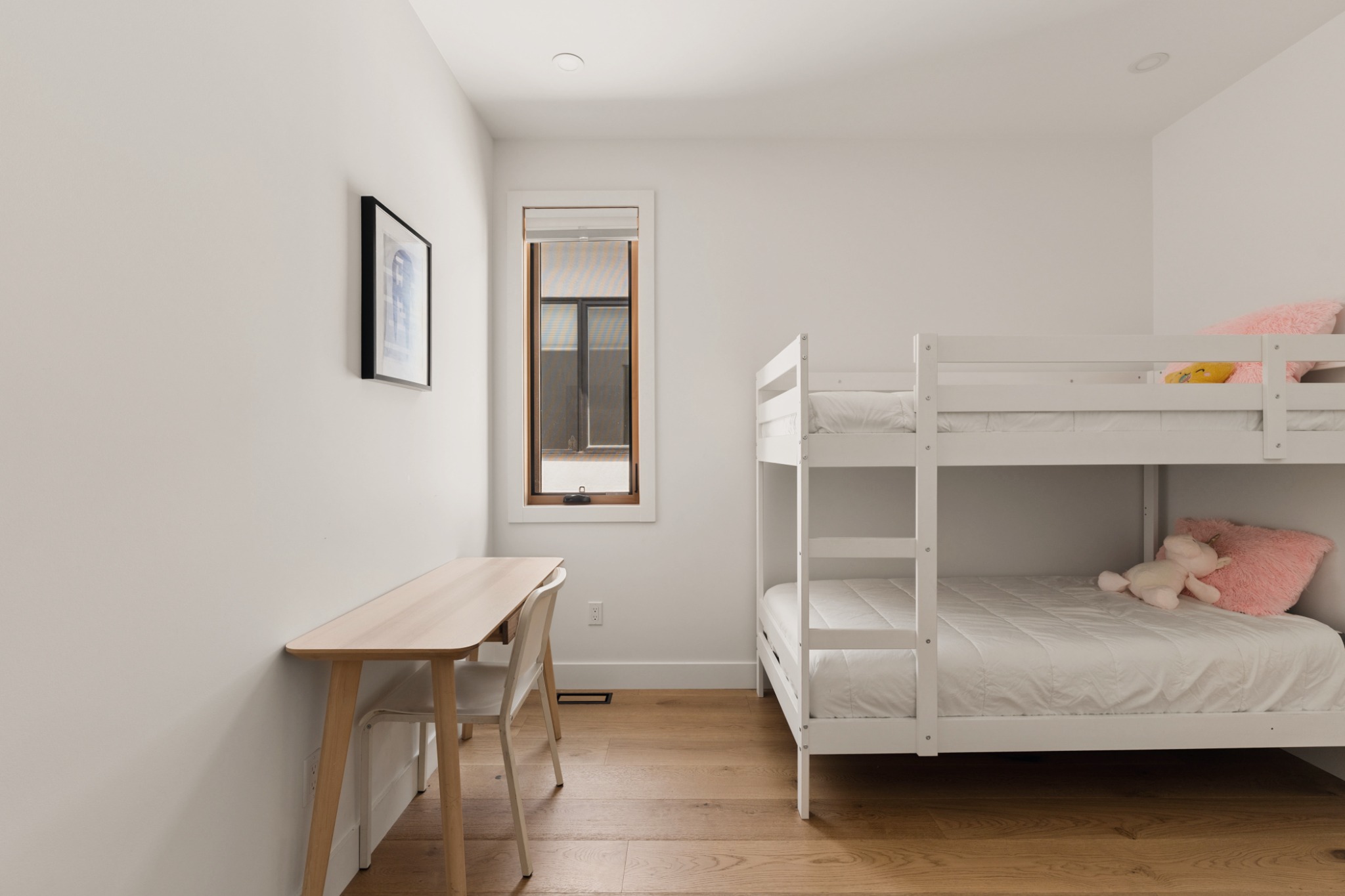 Kids bedroom with bunk bed and desk